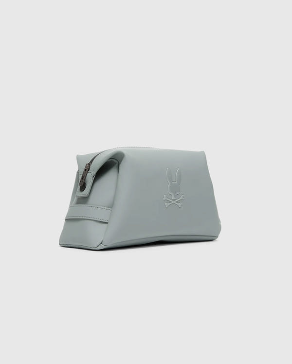 The Psycho Bunny MENS TOILETRY KIT - B6A636F200 is a minimalist light gray polyester pouch, ideal for organizing essentials on the go. It features a zippered top and an embossed bunny and crossbones design on the side, enhancing its sleek and modern look against the plain gray background.