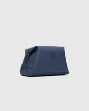 The MENS TOILETRY KIT - B6A636F200 by Psycho Bunny is a blue rectangular 100% polyester bag featuring an embossed rabbit and bones symbol on a light gray background. It includes a side zipper for organizing essentials on the go.