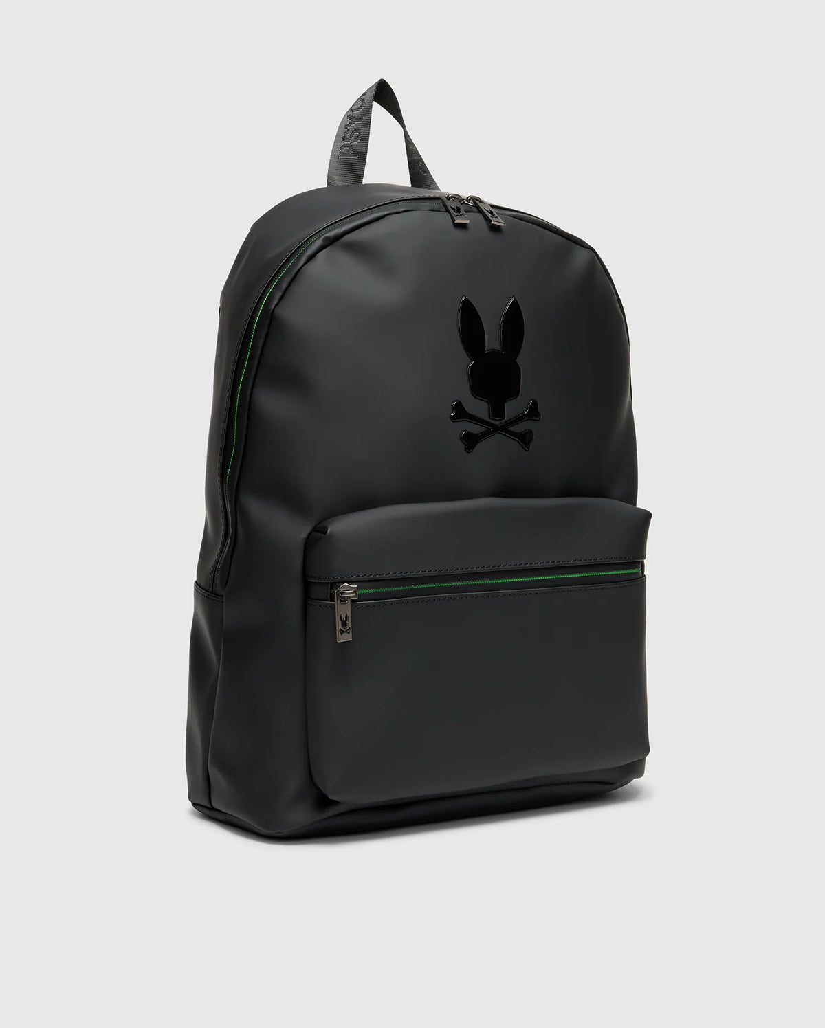The MENS RUBBERIZED BACKPACK - B6A637F200 by Psycho Bunny features a minimalist black design with a front zippered pocket. It showcases a stylized rabbit with crossbones logo on the front, crafted from smooth material for durability, and sleek zippers against a plain gray background.