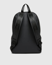 The MENS RUBBERIZED BACKPACK - B6A637F200 by Psycho Bunny is a sleek black accessory with embossed shoulder straps, minimalistic design, and smooth finish. It features simple black handles against a light gray background.