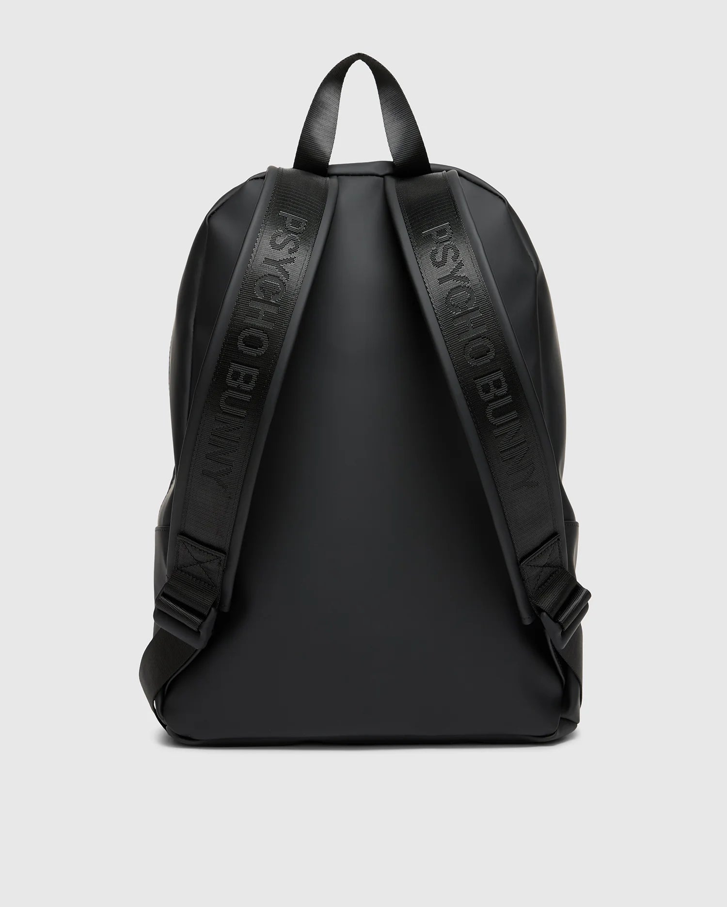 The MENS RUBBERIZED BACKPACK - B6A637F200 by Psycho Bunny is a sleek black accessory with embossed shoulder straps, minimalistic design, and smooth finish. It features simple black handles against a light gray background.
