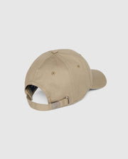 Back view of a beige MENS CLASSIC BASEBALL CAP - B6A816A1HT featuring a curved brim, an adjustable strap with a metal buckle, and stitched ventilation holes on each panel. This versatile accessory also boasts an embroidered Bunny logo. The cap is displayed on a plain, light background and belongs to the Psycho Bunny brand.