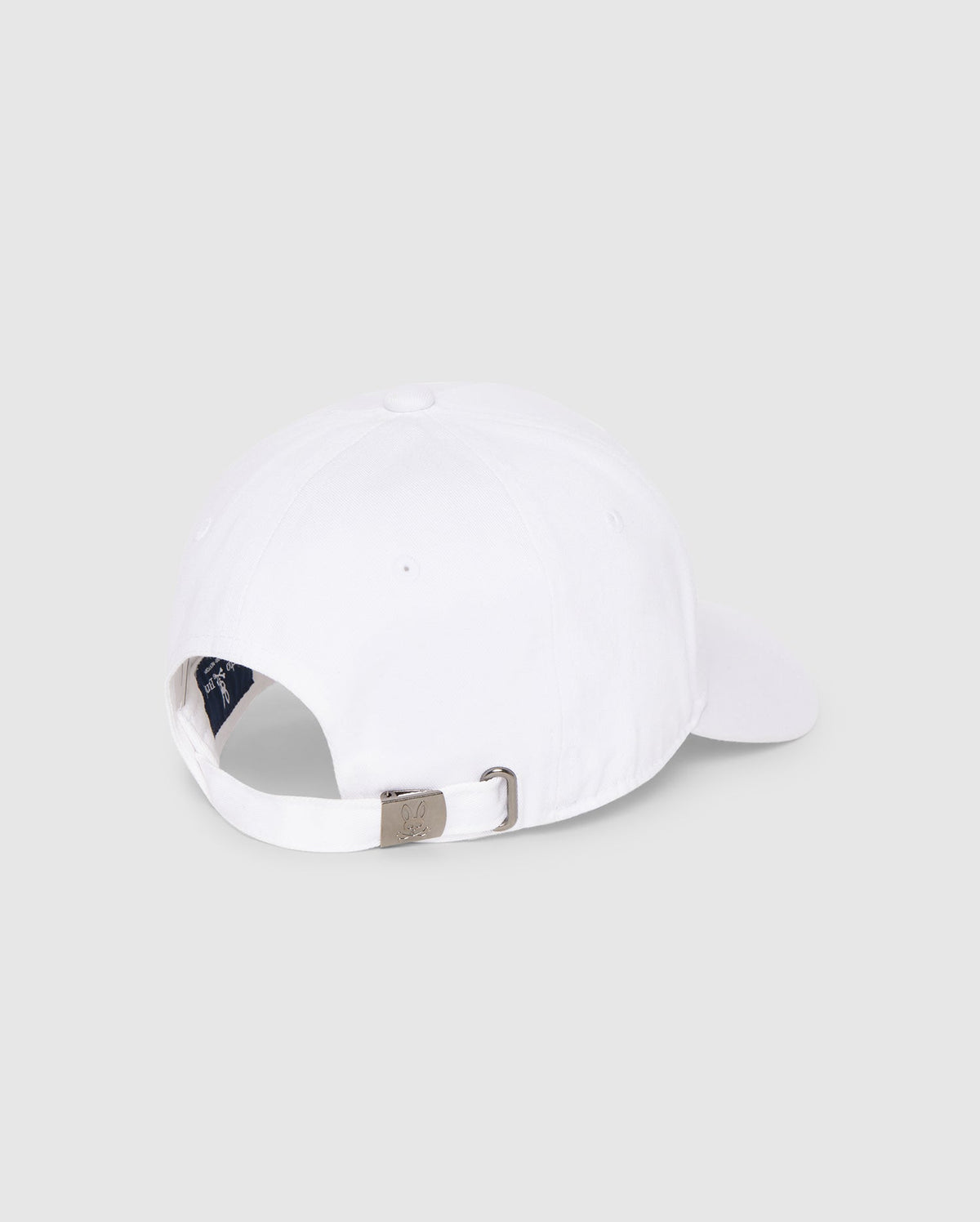 Back view of a Psycho Bunny MENS CLASSIC BASEBALL CAP - B6A816A1HT made from cotton twill, featuring an adjustable metal buckle strap engraved with a small logo. The cap is set against a plain, light gray background.