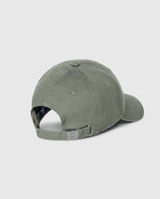 The Psycho Bunny MENS CLASSIC BASEBALL CAP - B6A816B200, crafted from 100% cotton in a solid pattern, is shown from the back with an adjustable strap and metal buckle against a light gray background.