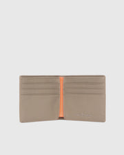 A luxury Psycho Bunny men's leather wallet is open, showcasing multiple card slots and an orange interior accent. The brand name is embossed in silver on the bottom right corner. The plain light gray background highlights the elegance of this premium accessory.