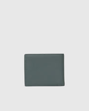 The MENS WORDMARK LEATHER WALLET - B6A868D200 by Psycho Bunny is showcased against a plain gray background. This men's stylish leather wallet features a contemporary green design with a sleek, smooth texture and meticulous stitching along the edges.
