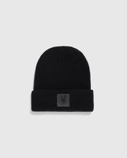 The Psycho Bunny MENS WAFFLE BEANIE - B6A873D200, crafted in black cotton knit with a folded brim, displays a small patch featuring a minimalist rabbit graphic. This winter knit hat is showcased against a light gray background.