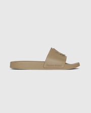 A single beige pool slide with a broad strap featuring the text "Psycho Bunny" embossed on it, presented against a white background.