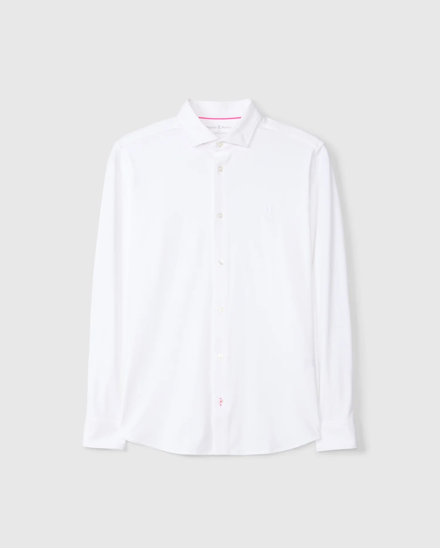 The MENS ARTHUR JERSEY SHIRT - B6C748D200 by Psycho Bunny is presented in a crisp white with a classic collar and long sleeves. Crafted from stretch Pima cotton, it includes a subtle embroidered chest logo. Against a plain gray background, this shirt combines both comfort and elegance.