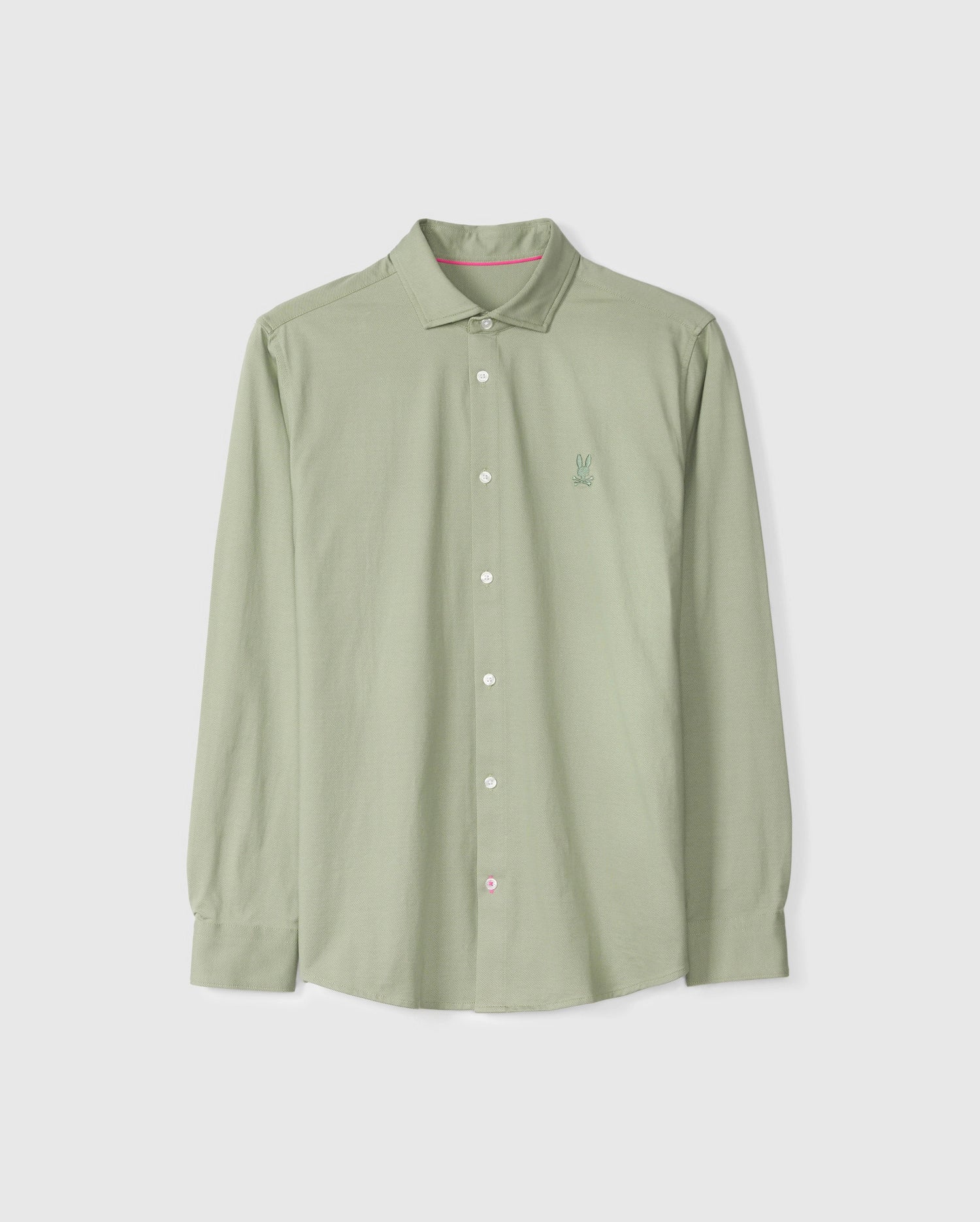 Displayed against a plain background is the MENS BRENDAN JERSEY SHIRT - B6C749D200 by Psycho Bunny, featuring a light green long-sleeve button-up design crafted from soft Pima cotton jersey. It is enhanced by white buttons and adorned with a small embroidered chest Bunny for added charm.