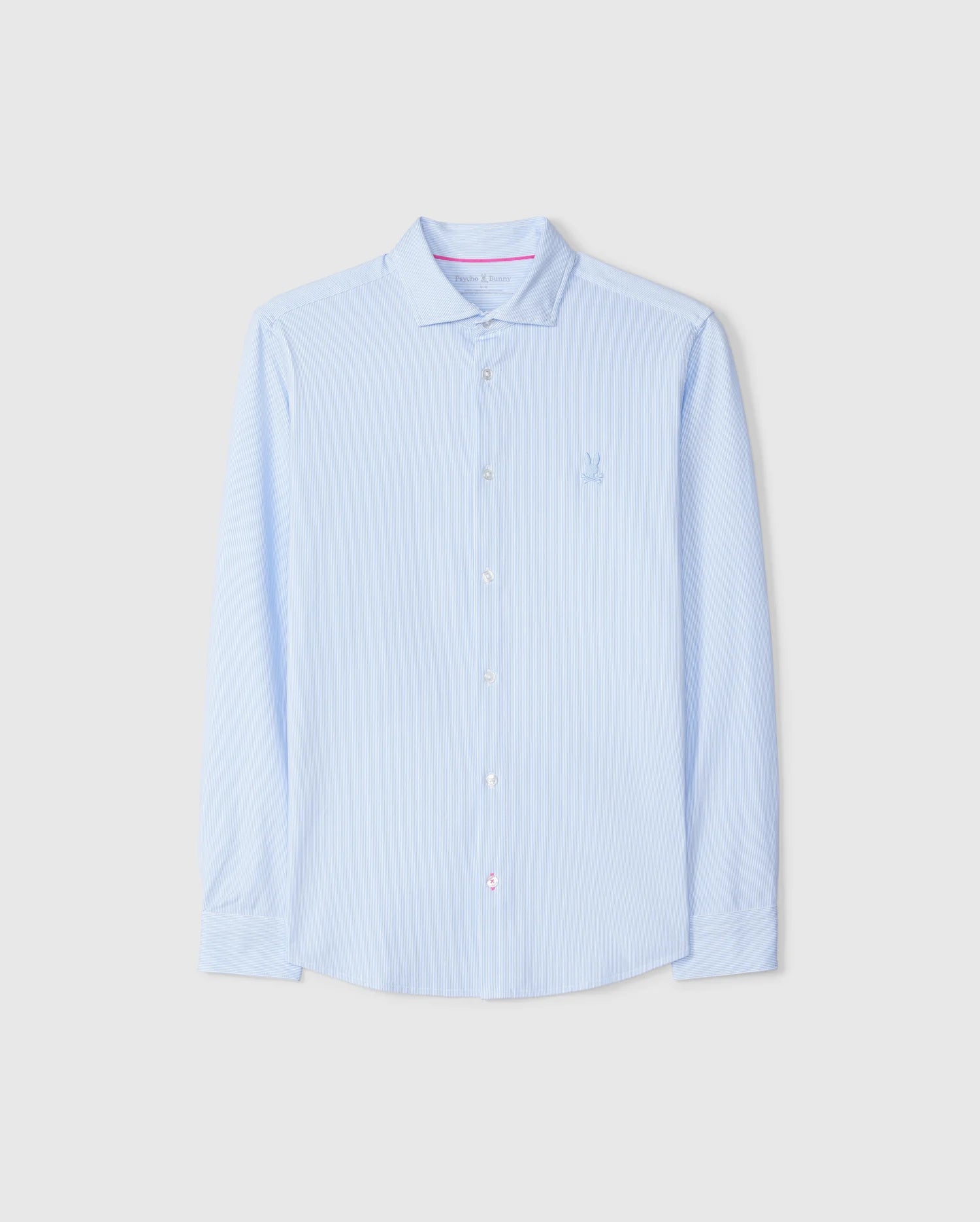 The Psycho Bunny MENS BROOK STRIPED JERSEY SHIRT - B6C750D200 in light blue is displayed against a plain background. This long-sleeve button-up shirt is crafted from Pima cotton and features subtle vertical stripes, a collar, and a small embroidered emblem on the chest. It offers a comfortable fit with white buttons and maintains a clean, crisp appearance.