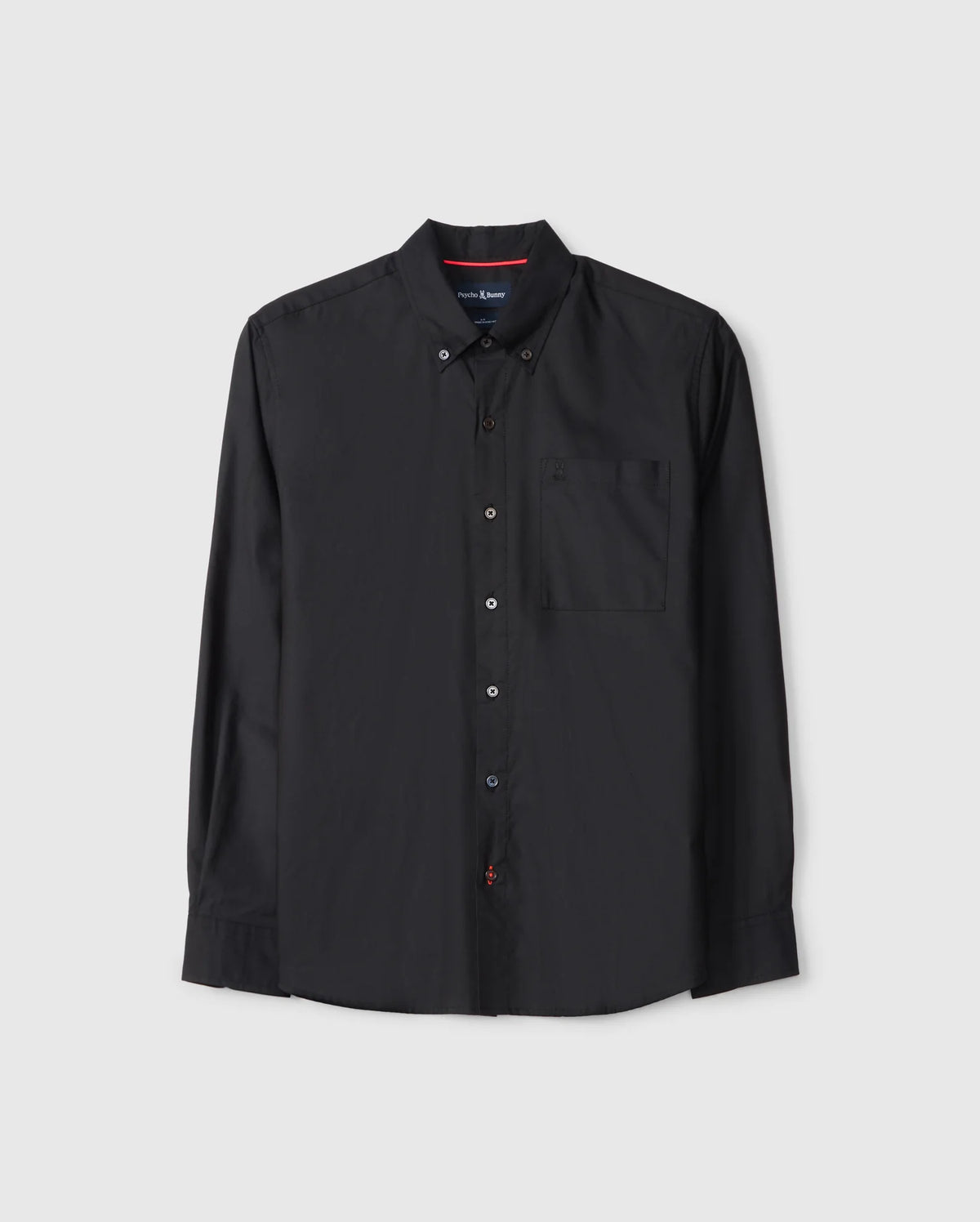 The Psycho Bunny MENS JARED COTTON MODAL SHIRT (B6C774D200) is a black long-sleeve button-up with a collar and chest pocket, crafted from soft modal fabric. It features a simple design with red stitching detail on the second buttonhole.