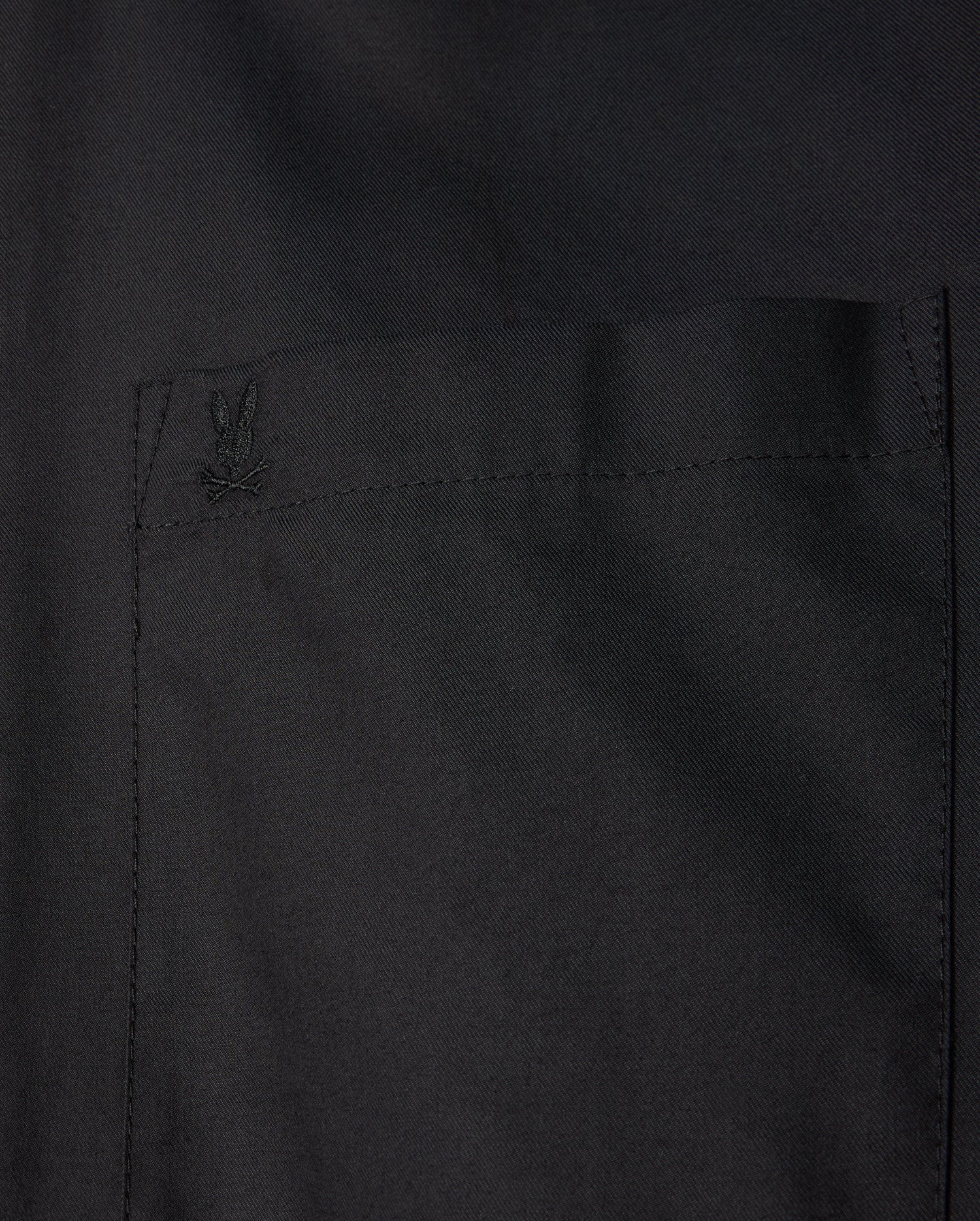 The Psycho Bunny MENS JARED COTTON MODAL SHIRT - B6C774D200 is a premium black shirt featuring a tone-on-tone logo embroidered on the pocket.