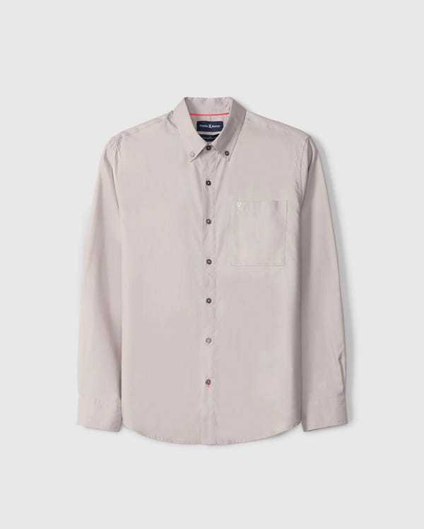 The Psycho Bunny MENS JARED COTTON MODAL SHIRT (B6C774D200) is a beige shirt featuring long sleeves, a button-up closure, collar, and front chest pocket. Crafted from premium cotton-modal blend and displayed on a plain white background, it exemplifies timeless style and comfort.