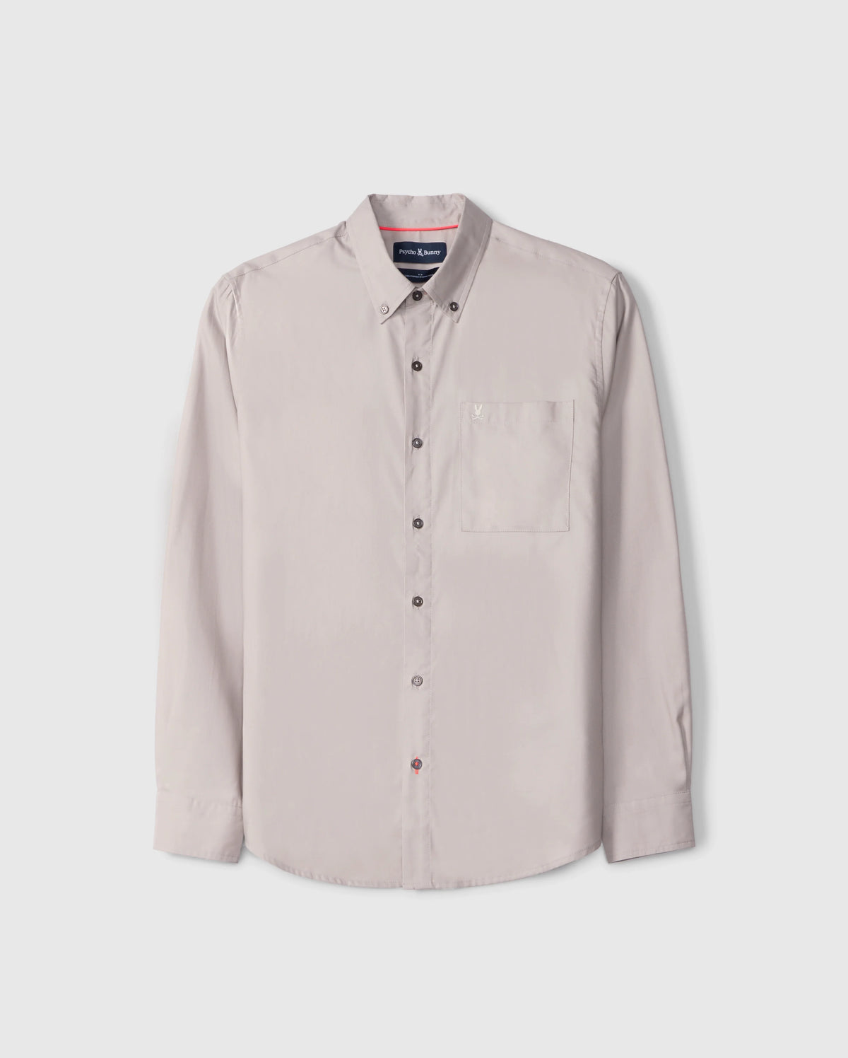 The Psycho Bunny MENS JARED COTTON MODAL SHIRT (B6C774D200) is a beige shirt featuring long sleeves, a button-up closure, collar, and front chest pocket. Crafted from premium cotton-modal blend and displayed on a plain white background, it exemplifies timeless style and comfort.