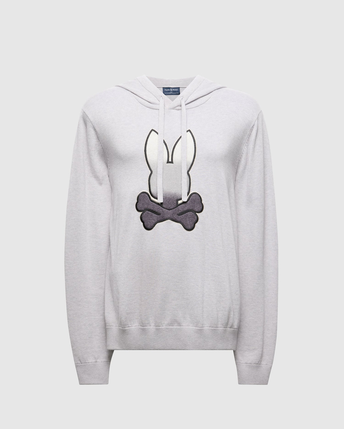 The Psycho Bunny MENS BULDER HOODED SWEATER (B6E261E200) is crafted in light gray Supima Cotton, featuring a cartoon-style black and white emblem with bunny ears above crossed bones on the front, enhancing its premium quality against a plain background.