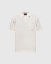 The cream-colored Psycho Bunny Longford Polo (MENS LONGFORD FINE KNIT POLO - B6E500F200) is crafted from fine-knit cotton and features a classic collar, three-button placket, chest pocket with an embroidered Bunny, all on a plain background.