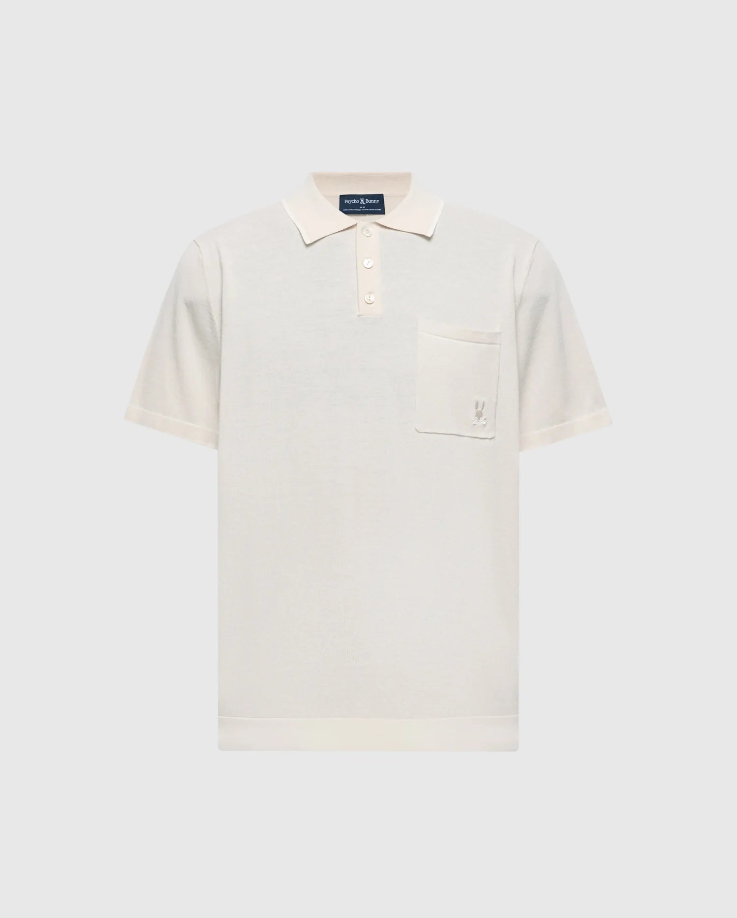 The cream-colored Psycho Bunny Longford Polo (MENS LONGFORD FINE KNIT POLO - B6E500F200) is crafted from fine-knit cotton and features a classic collar, three-button placket, chest pocket with an embroidered Bunny, all on a plain background.