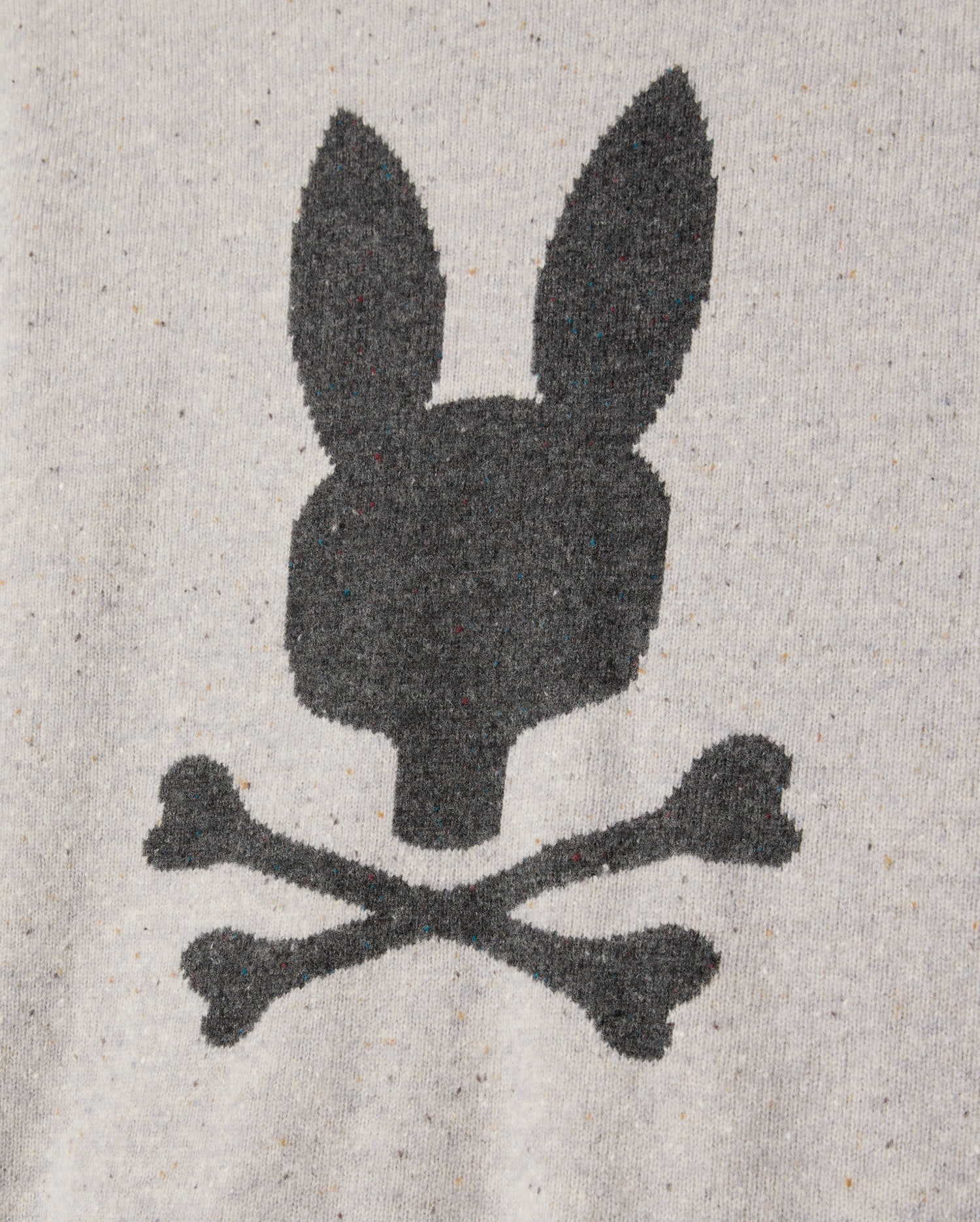 The Psycho Bunny Mens Lincoln Merino Wool Sweater (B6E831D200) features a black silhouette of a rabbit head with long ears above two crossed bones, akin to a skull and crossbones design, printed on a heather gray fabric background, offering a timeless style crafted from luxurious merino wool.