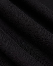 A detailed view of the Psycho Bunny MENS BELMORE EXTRA FINE COTTON SWEATER - B6E832D200 showcases the intricate ribbed texture formed by parallel lines in its extrafine cotton knit. The lighting accentuates the sweater's high-quality stitching, enhancing its soft and luxurious look.