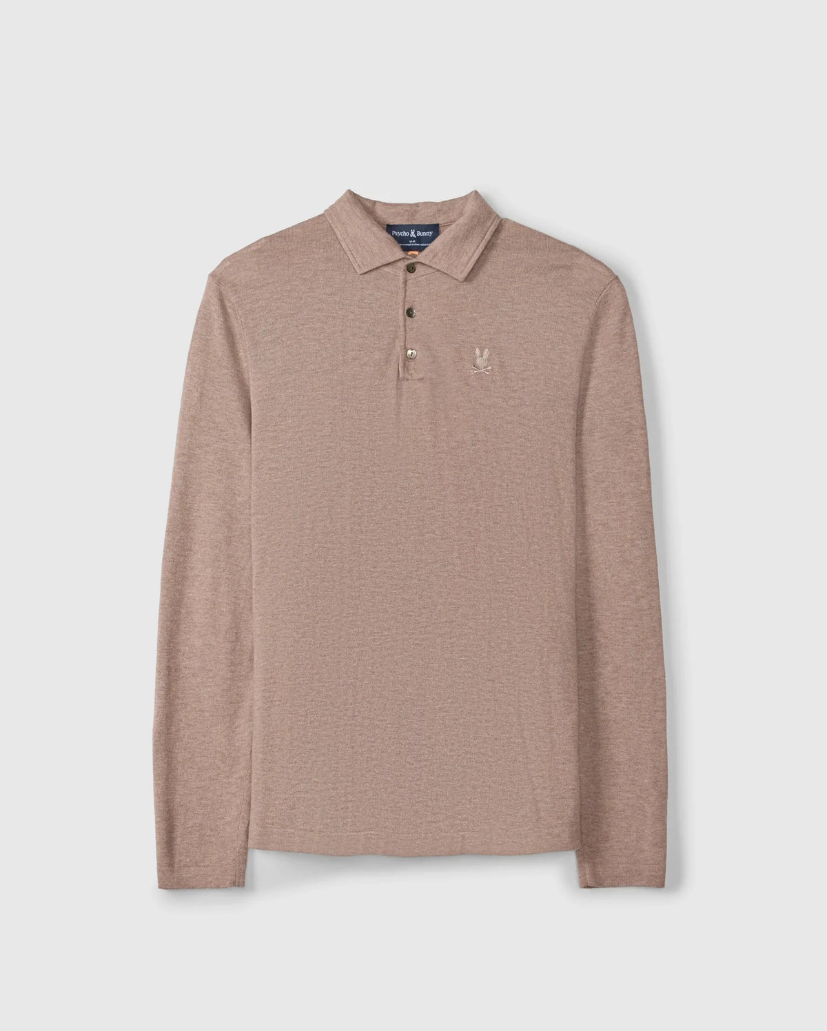 Introducing the Psycho Bunny Men's Bradshaw Polo Sweater, Beige - B6E835D200, a luxurious knitwear piece crafted from soft Merino wool. This polo features long sleeves, a classic collar with a refined three-button placket, and is enhanced by its textured fabric for added elegance. A small embroidered rabbit motif logo on the left chest elevates its sophisticated appeal.