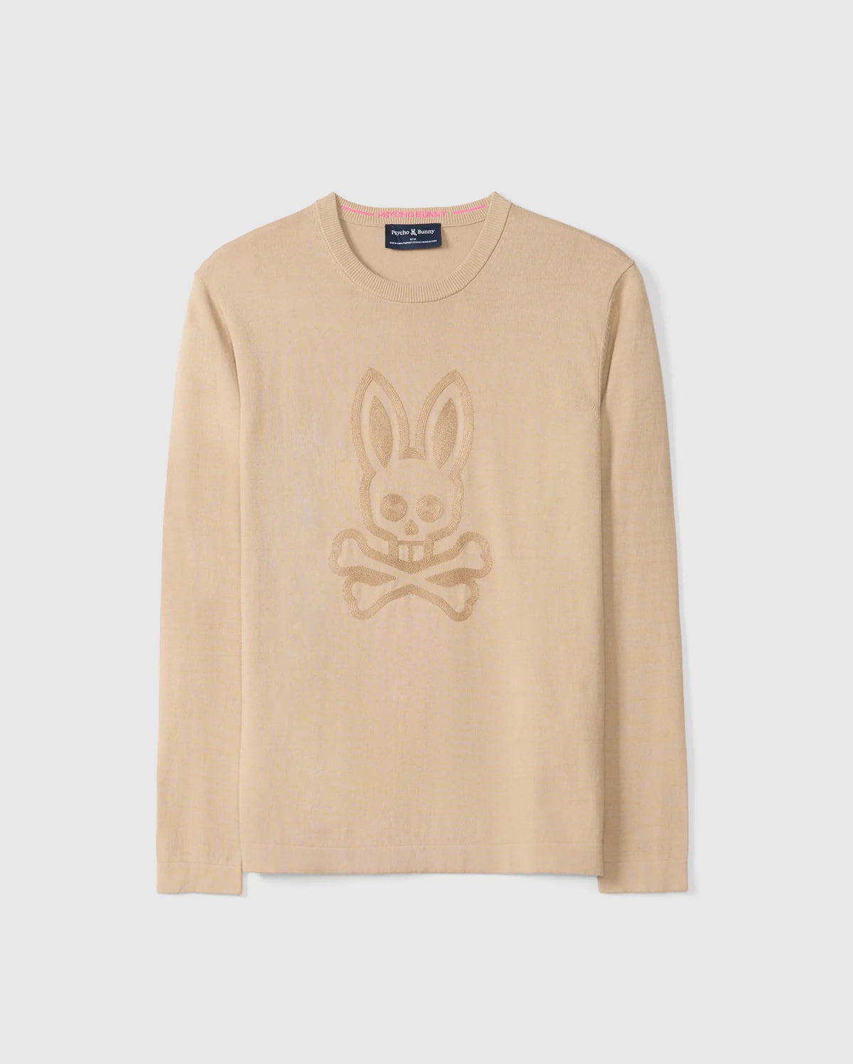 The Psycho Bunny Men's Cory Chainstitch Cotton Sweater, model number B6E893D200, is a lightweight cotton knit featuring a tonal skull and crossbones with bunny ears design on the front. It boasts a round neckline and long sleeves adorned with intricate chainstitch embroidery, all set against a plain white background.