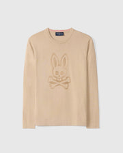 The Psycho Bunny Men's Cory Chainstitch Cotton Sweater, model number B6E893D200, is a lightweight cotton knit featuring a tonal skull and crossbones with bunny ears design on the front. It boasts a round neckline and long sleeves adorned with intricate chainstitch embroidery, all set against a plain white background.