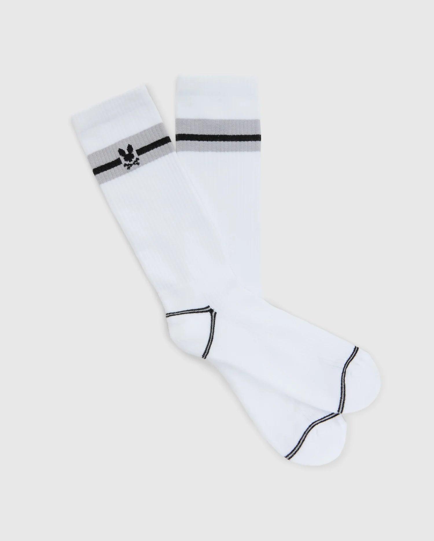 The Psycho Bunny MENS SPORT SOCK (B6F150E200) features white Pima cotton fabric with a chic black stripe near the knee, a small rabbit-in-sunglasses emblem, and black toe and heel trim for added style.