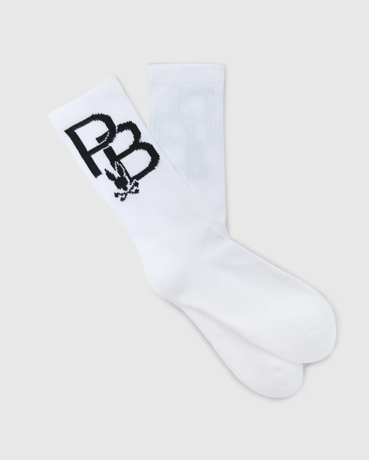 A pair of crew sport socks from the Psycho Bunny Men's Sport Sock Box Set (B6F268E200) for men, featuring bold black "PB" letters and a small graphic design near the top. Made from moisture-wicking Peruvian Pima cotton, these white socks are laid flat against a light gray background, highlighting their premium comfort and style.