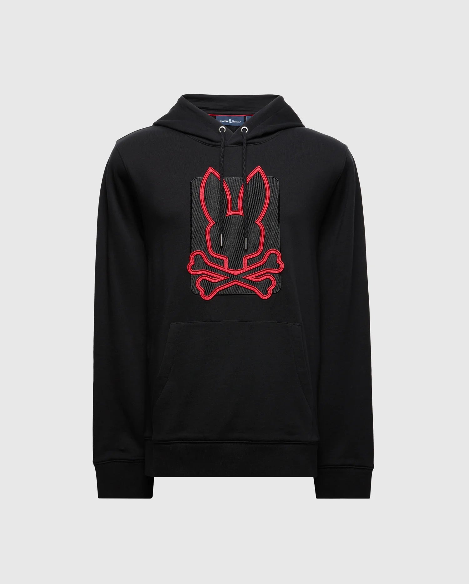 Introducing the Psycho Bunny MENS PIERCE ESSENTIAL FRENCH TERRY HOODIE - B6H135E200, a black cotton hoodie showcasing a striking red graphic of a stylized rabbit with crossbones prominently on the front. This bold design is centrally placed, enhancing its fashionable allure. The hoodie includes a front pocket and drawstring hood, presented against an understated plain background.