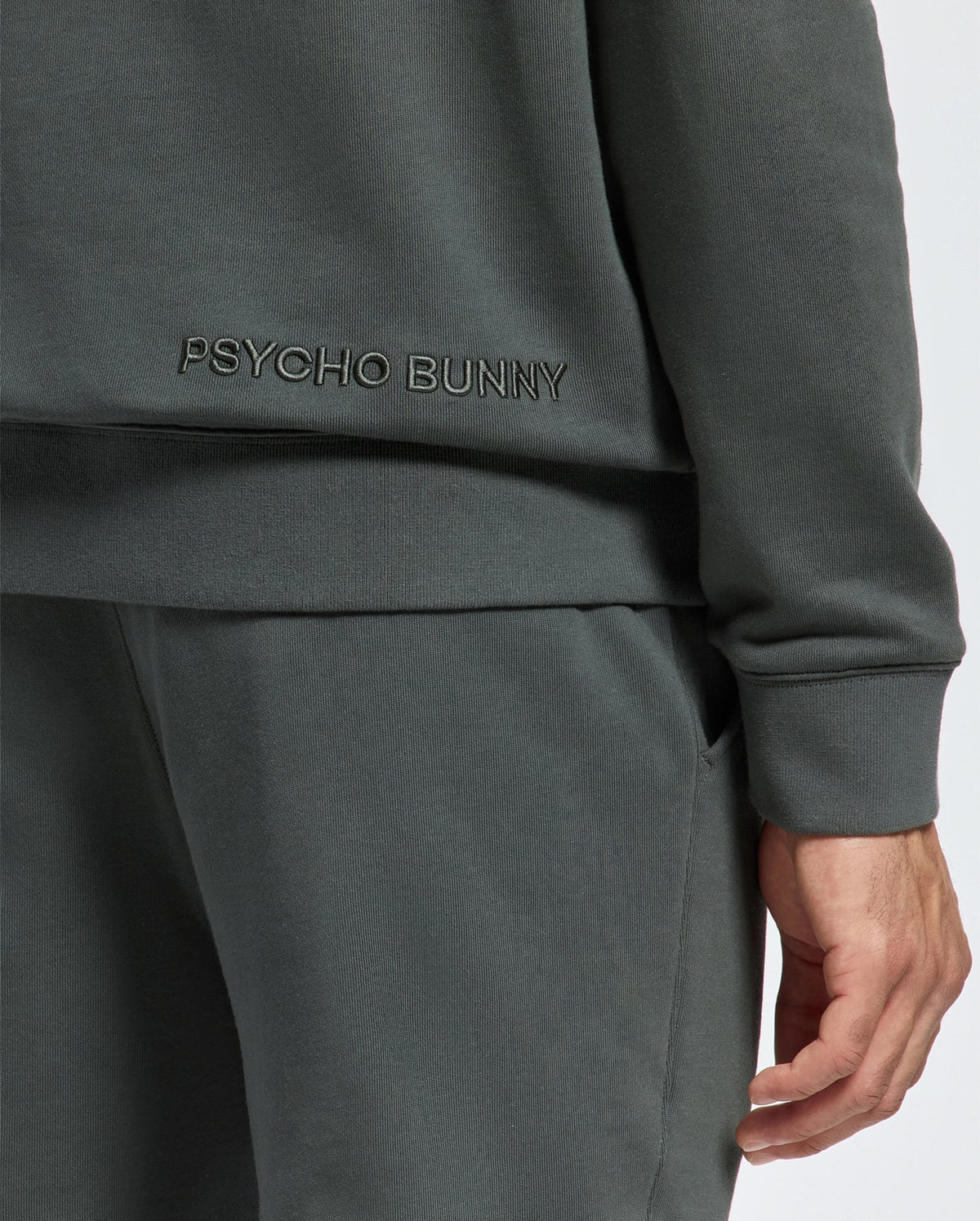 Psycho Bunny's Men's Pierce Essential French Terry Hoodie is expertly crafted to provide comfort and style, making it an essential addition to your wardrobe.