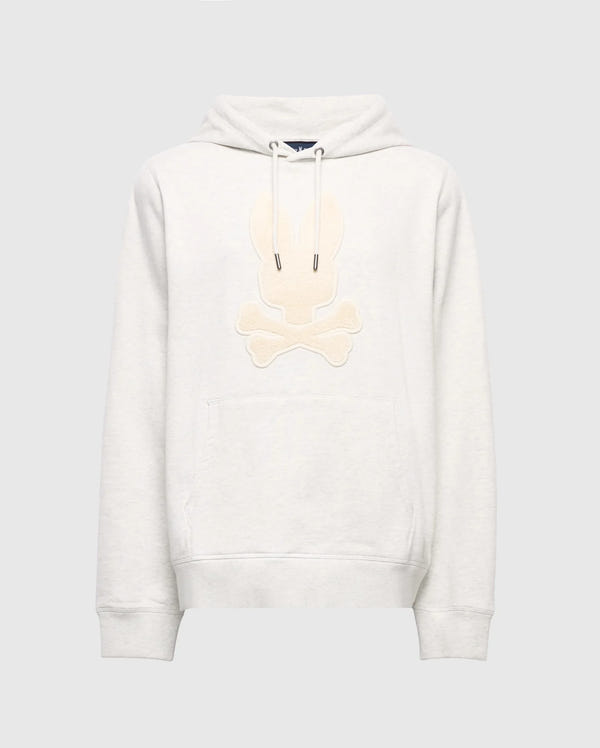 The Psycho Bunny MENS ELDORADO BRUSH BACK HOODIE (B6H234E200) is a cozy light gray, featuring a beige embroidered skull and crossbones with bunny ears, brush-back comfort, front pocket, and hood drawstrings—ideal for swaddle season style.