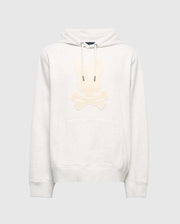 The Psycho Bunny MENS ELDORADO BRUSH BACK HOODIE (B6H234E200) is a cozy light gray, featuring a beige embroidered skull and crossbones with bunny ears, brush-back comfort, front pocket, and hood drawstrings—ideal for swaddle season style.