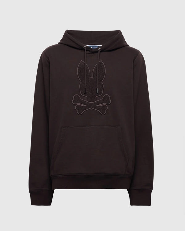 The Psycho Bunny MENS ELDORADO BRUSH BACK HOODIE - B6H234E200 in black features a rabbit head with crossed bones on the front, has a cozy kangaroo pocket, and drawstrings at the neck, set against a plain white background.