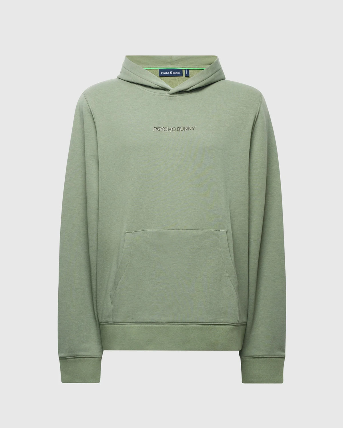 The MENS NORA CLASSIC FRENCH TERRY HOODIE - B6H434F200 by Psycho Bunny is sage green with long sleeves, a front pocket, and a drawstring-free hood. Made from soft French terry, it features an embroidered wordmark logo on the chest against a plain light gray backdrop.