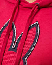 Close-up of the red MENS WALTER LIGHTWEIGHT HOODIE by Psycho Bunny, showcasing 3D outlined bunny ears embroidery on the front. The hoodie strings and stitching details are prominently visible.