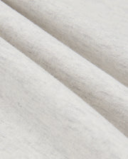 Close-up image of the Psycho Bunny MENS JAMES PREMIUM HOODIE - B6H789D200, highlighting its premium jersey fabric with a soft texture, gentle folds, and subtle gray speckles. The material looks lightweight and comfortable, promising a touch of stylish warmth.