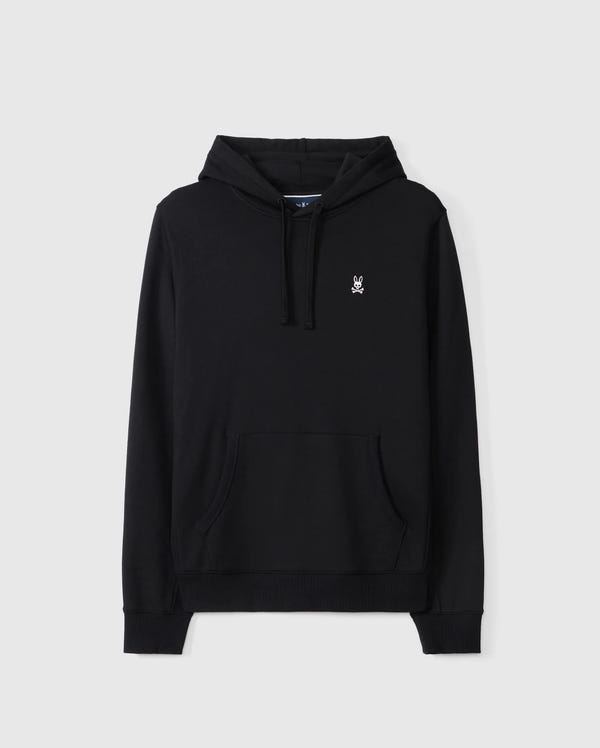 Introducing the Psycho Bunny MENS LEVY FLEECE HOODIE - B6H859D200: This black French terry hoodie comes with long sleeves, a front kangaroo pocket, and features a small embroidered white bunny logo on the left chest. Crafted from 100% cotton, this essential Levy hoodie also includes a drawstring for hood adjustment. The background is plain and light gray.