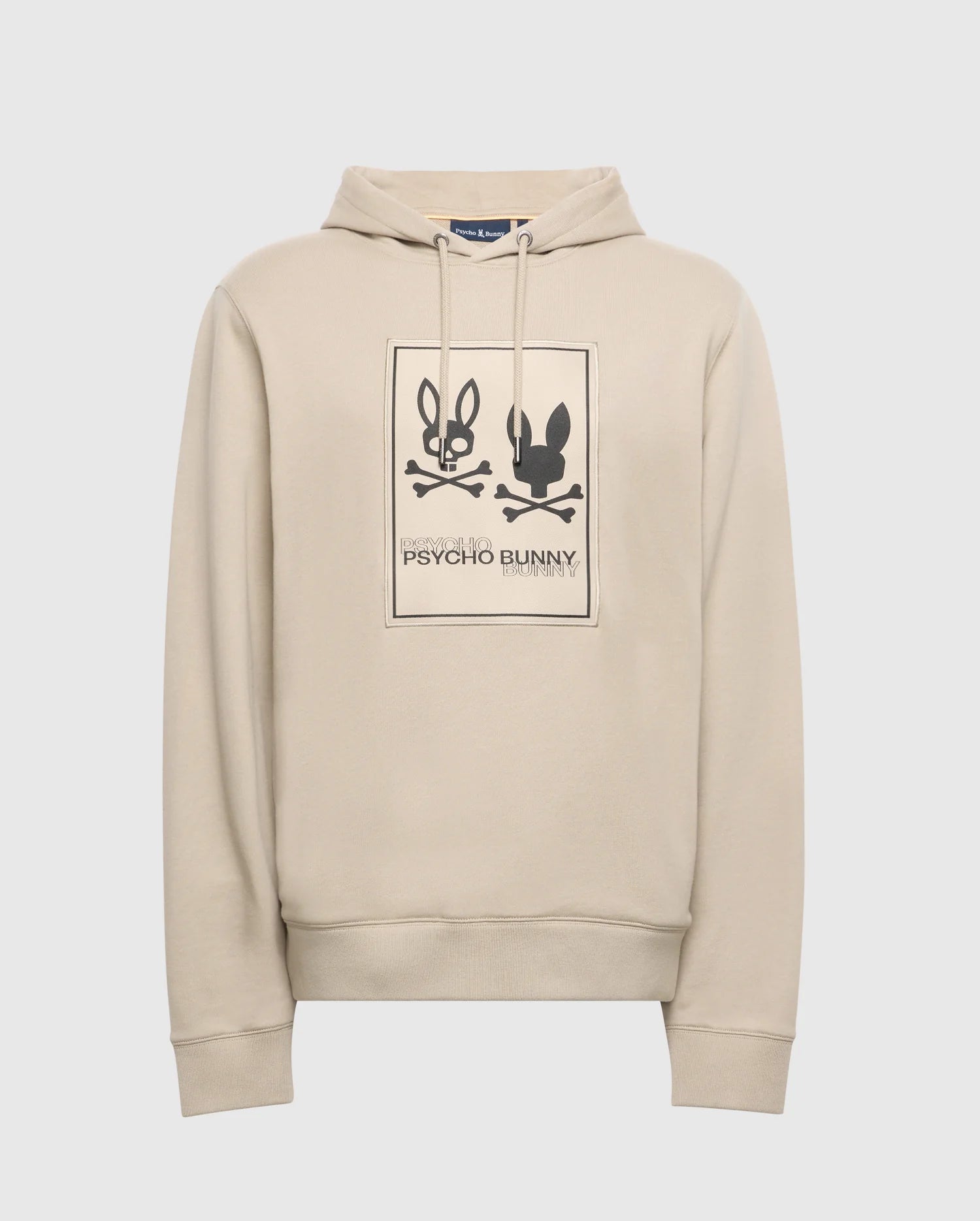 Enjoy the comfort of the Psycho Bunny Men's Monroe Twill Patch Fleece Hoodie, crafted from French terry. It showcases a graphic print with two stylized bunny faces over crossed bones in a rectangle, complete with tonal accents and "Psycho Bunny" branding.