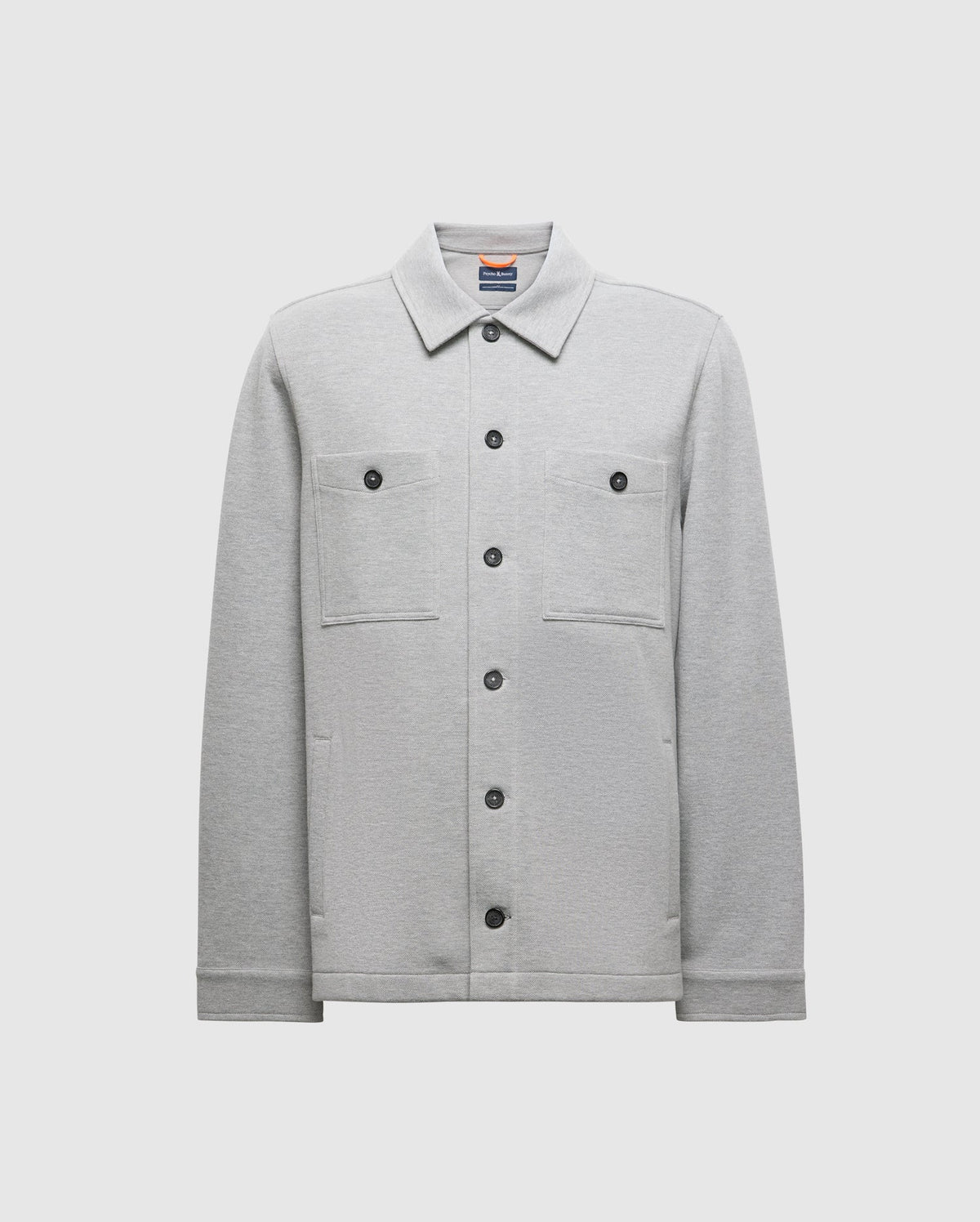 The BEDFORD SHIRT JACKET (B6J290B200) by Psycho Bunny features a gray design with two chest pockets and black buttons, presented against a plain white background.