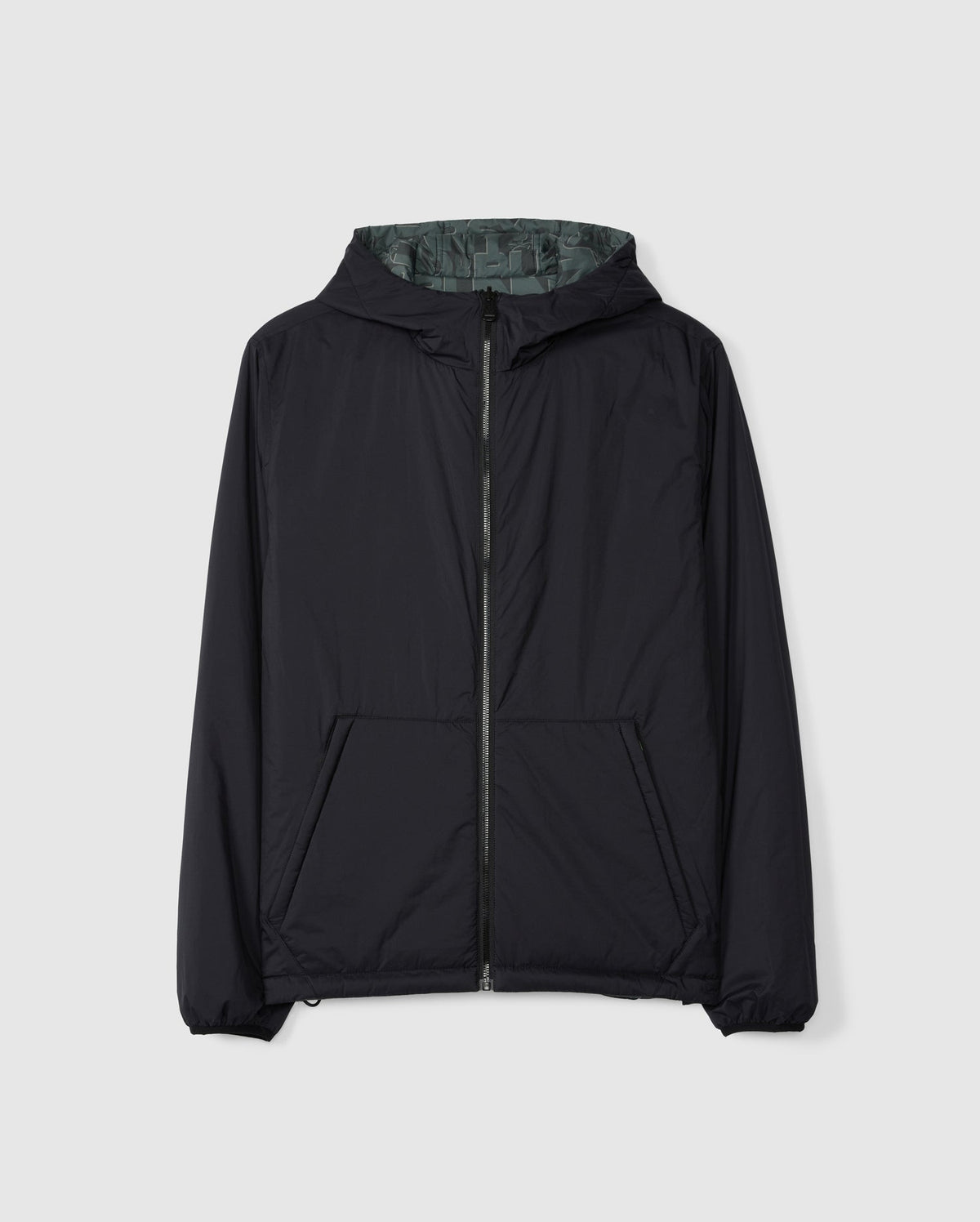 The SOUTHWORTH REVERSIBLE PADDED HOODED JACKET - B6J946D200 by Psycho Bunny is black, features a central zipper, and has two angled front pockets. It's displayed on a plain white background with a subtle design.
