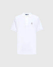 This Psycho Bunny Men's Classic Pique Polo Shirt (B6K001ARPC) is crafted from 100% Pima cotton in plain white, featuring a collar and short sleeves. It boasts a three-button placket with mother-of-pearl buttons and an embroidered small rabbit logo on the left chest, set against a light grey background.