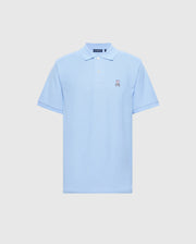 The Psycho Bunny Men's Classic Piqué Polo Shirt (B6K001B200) in light blue presents an embroidered Bunny logo on the left chest. Made from premium Pima cotton, it includes short sleeves and a buttoned collar, all set against a plain white background.