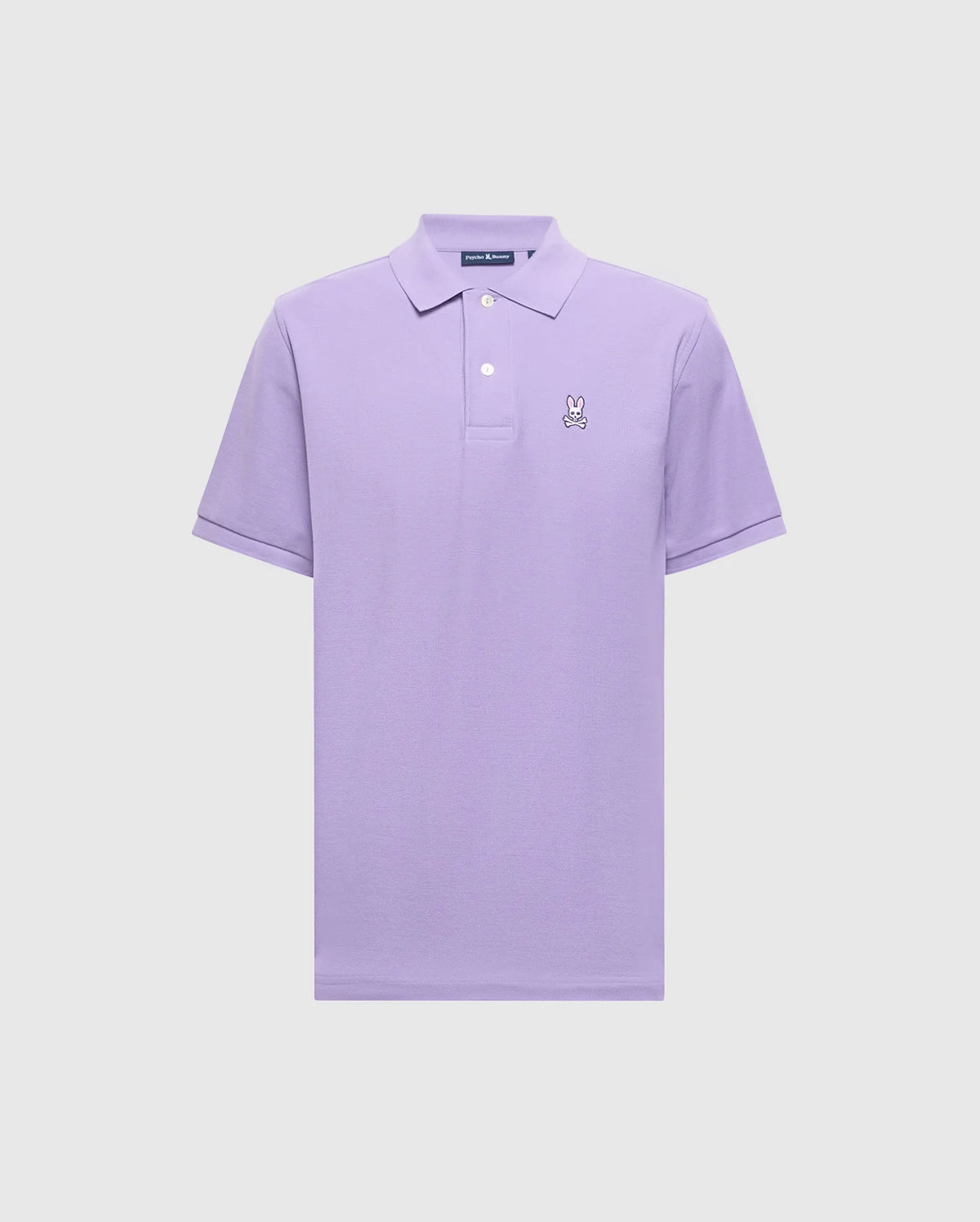 The Psycho Bunny Men's Classic Pique Polo (B6K001Z1PC) in lavender, made of soft Pima cotton, features short sleeves, a collar, and a buttoned placket. It showcases an embroidered cartoon Bunny logo on the left chest against a plain light background.