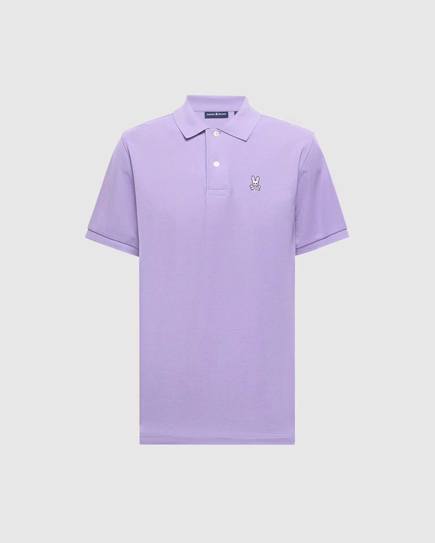 The Psycho Bunny Men's Classic Pique Polo (B6K001Z1PC) in lavender, made of soft Pima cotton, features short sleeves, a collar, and a buttoned placket. It showcases an embroidered cartoon Bunny logo on the left chest against a plain light background.