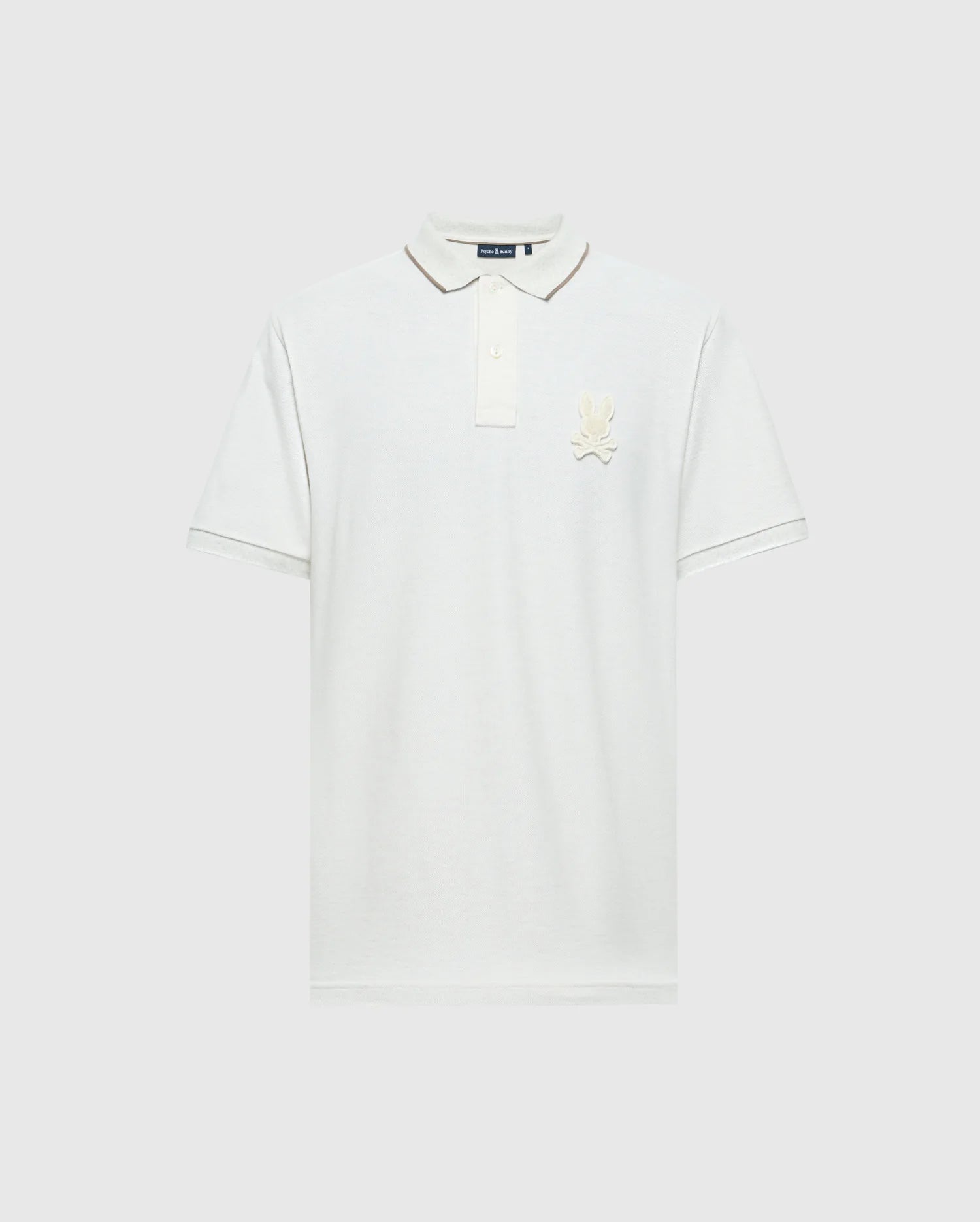The Psycho Bunny MENS ELDORADO PIQUE POLO (B6K105E200) is a plain white shirt made from luxurious Peruvian Pima cotton. It features short sleeves, a classic collar with a three-button placket, a regular fit, and an embroidered logo on the left chest against the white fabric.