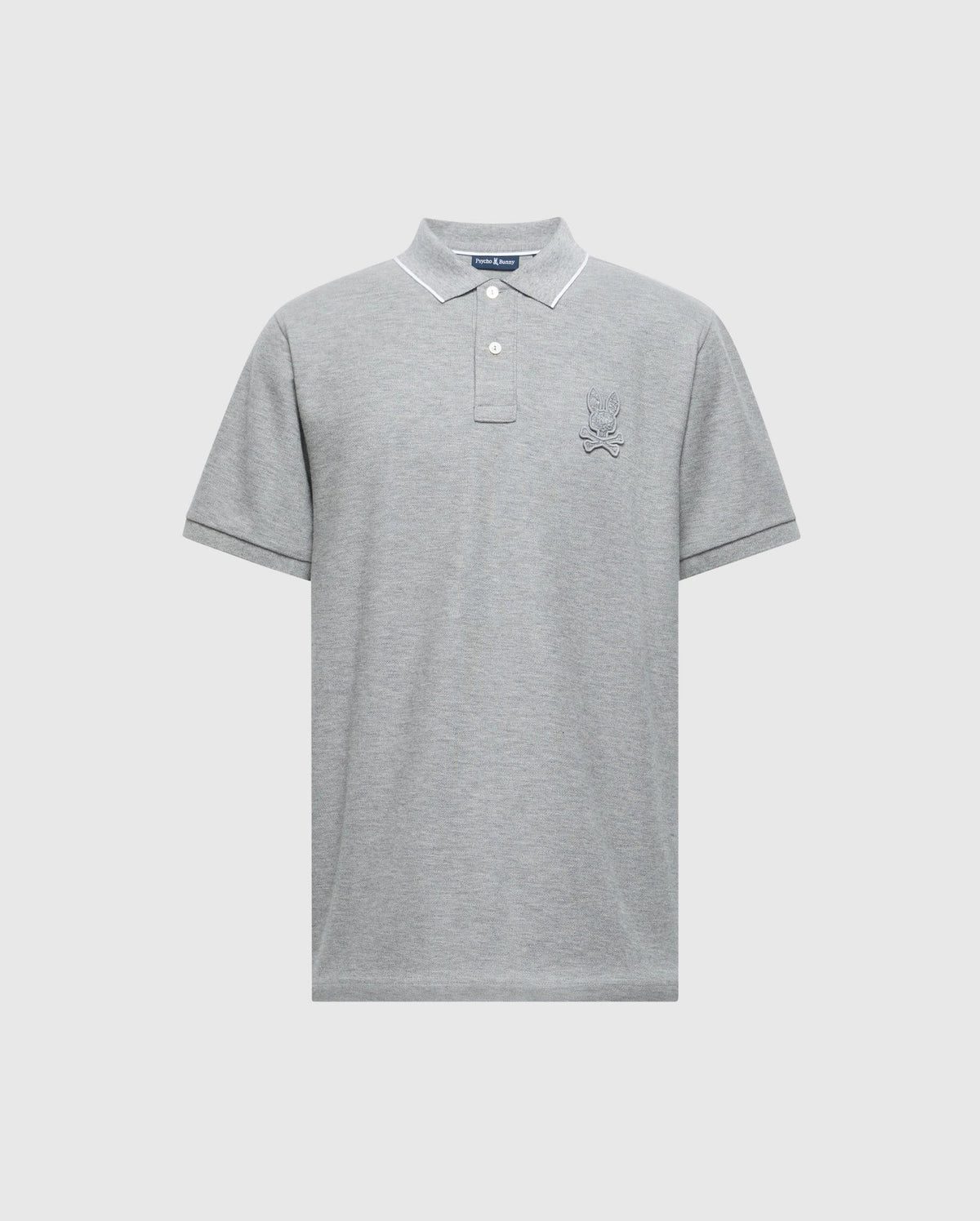 The Psycho Bunny MENS ELDORADO PIQUE POLO - B6K105E200 in gray is crafted from soft Pima cotton, featuring short sleeves, a collared neckline, and a three-button placket with Mother-of-Pearl buttons. It has an embroidered design on the left chest for a minimalist and elegant style.