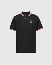 The Psycho Bunny MENS STRATTON SPORT PIQUE POLO (B6K202E200) features a black design with a red and white striped collar and sleeves, a small bunny logo on the left chest, and moisture-wicking technology for comfort and dryness.