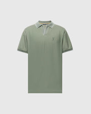The Psycho Bunny MENS EAST HILLS JOHNNY COLLAR POLO (B6K331B200) is a green shirt with a white-trimmed Johnny collar and short sleeves. Made from 100% Pima cotton, it features an embroidered logo on the left chest and is showcased against a light grey background.