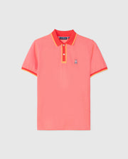 The Psycho Bunny MENS WOODWAY OXFORD POLO - B6K405C200 is a brightly colored short-sleeve polo shirt in coral pink with red and yellow trim on the collar and sleeves. Made from a soft Pima cotton-blend, it features a classic two-button placket and a small embroidered bunny logo on the left chest.